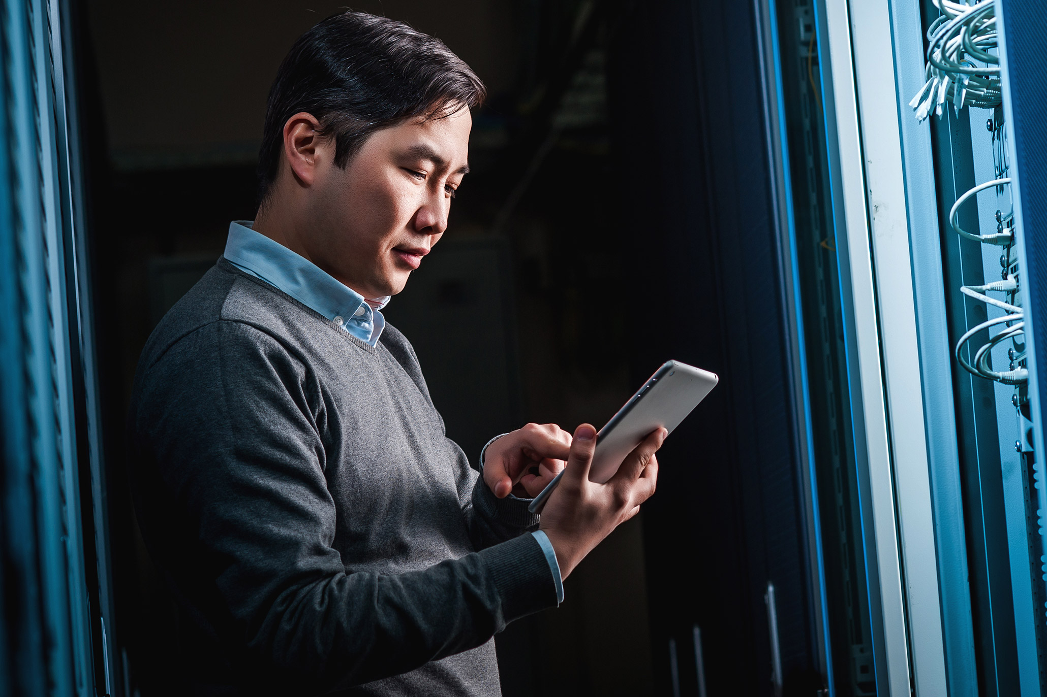 Man surfing on tablet analyzing data